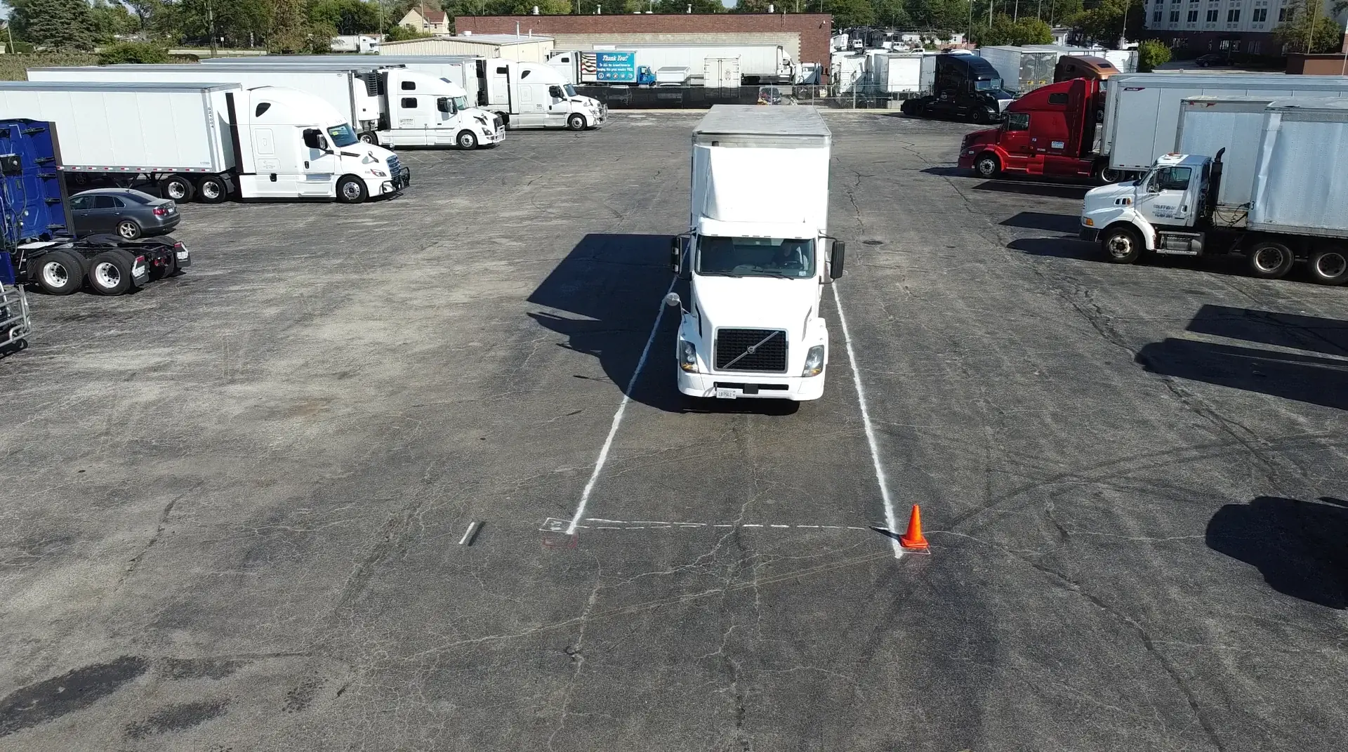 Semi-truck backing through cones at the All-In CDL Zion training yard